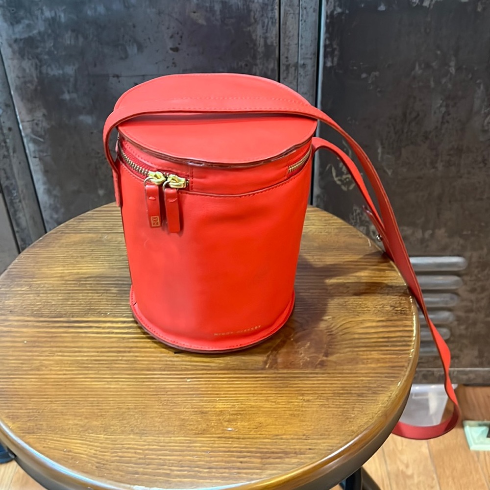 Red bucket bag with adjustable long strap